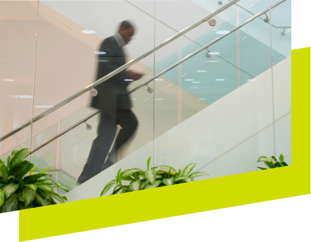 A financial professional climbing the stairs which is a visual representation of how the insurance and financial planning solutions from Concourse Financial Group can help move a business forward.